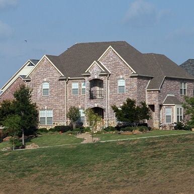 Exterior of brick home in Colleyville by Platinum Painting