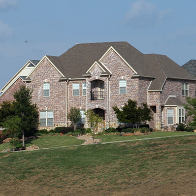 Exterior of brick home in Trophy Club by Platinum Painting