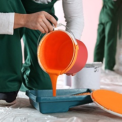 Professional painters working inside commercial space