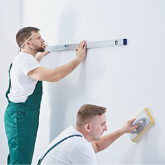 Painters measuring and taping