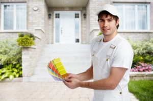 man holding colors outside