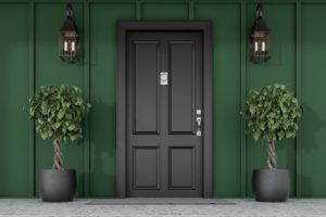 green house with black door showing exterior paint trends