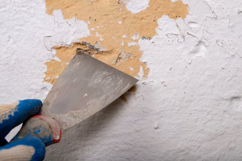 removing old paint from the wall