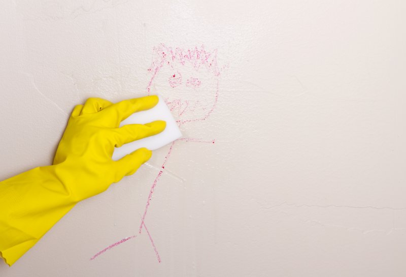 closeup of person cleaning walls
