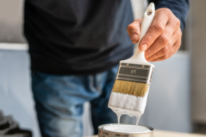 a person holding a paintbrush