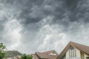 dark clouds over a painted house exterior