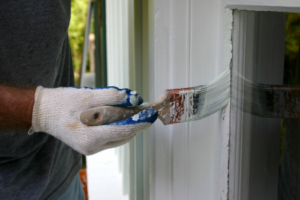 a homeowner painting their home